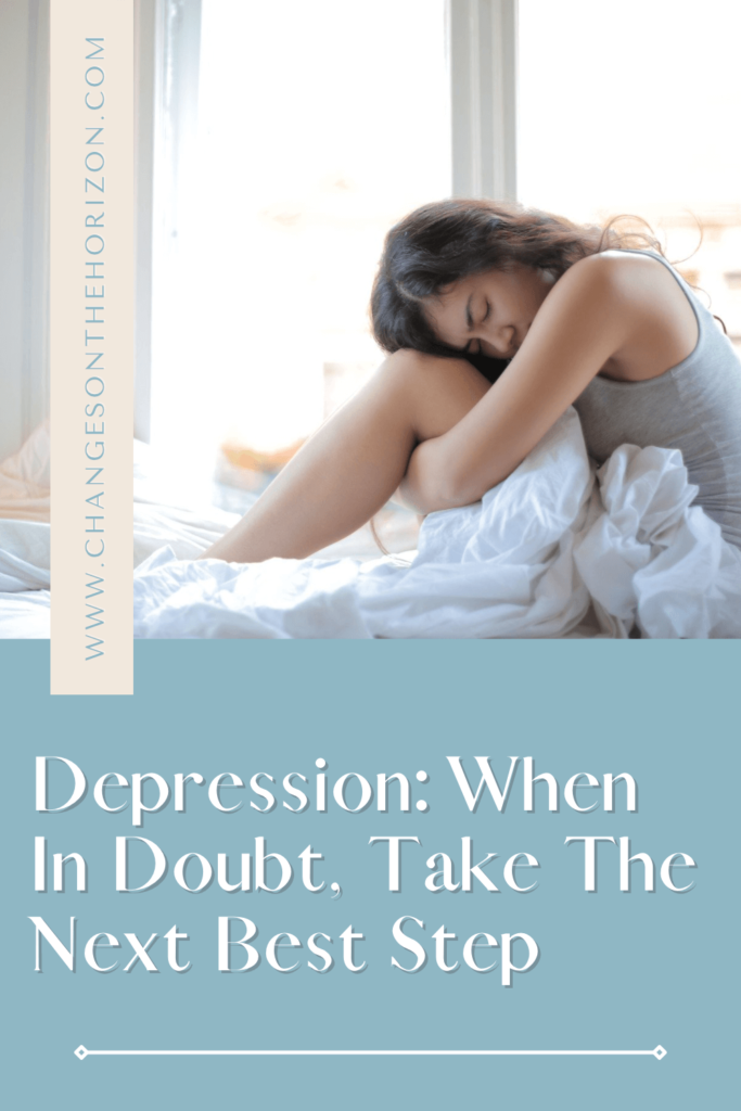 pinterest pin with the title of the blog post about depression and a vertical banner with website address. the top half of pin has a picture of a woman sitting up in beg hugging her knees wearing a grey tank top